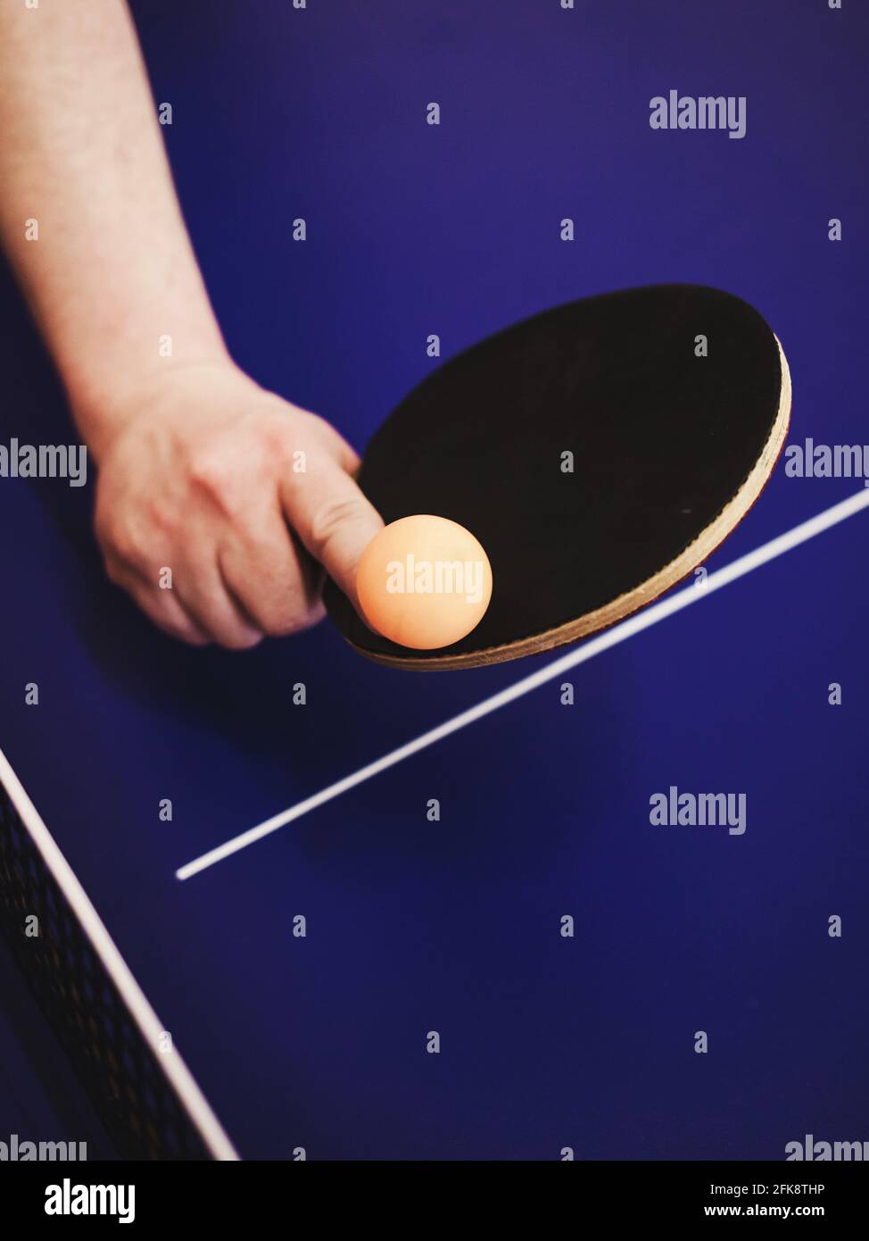 ping pong player hits a ball with a racket Stock Photo Alamy
