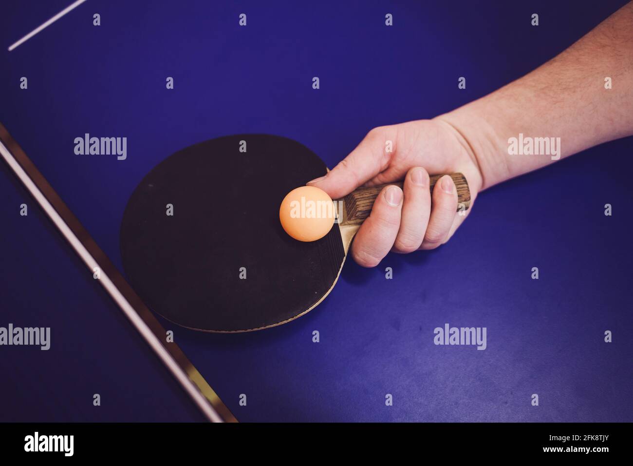 hand with rocket hits the ball. ping pong Stock Photo Alamy