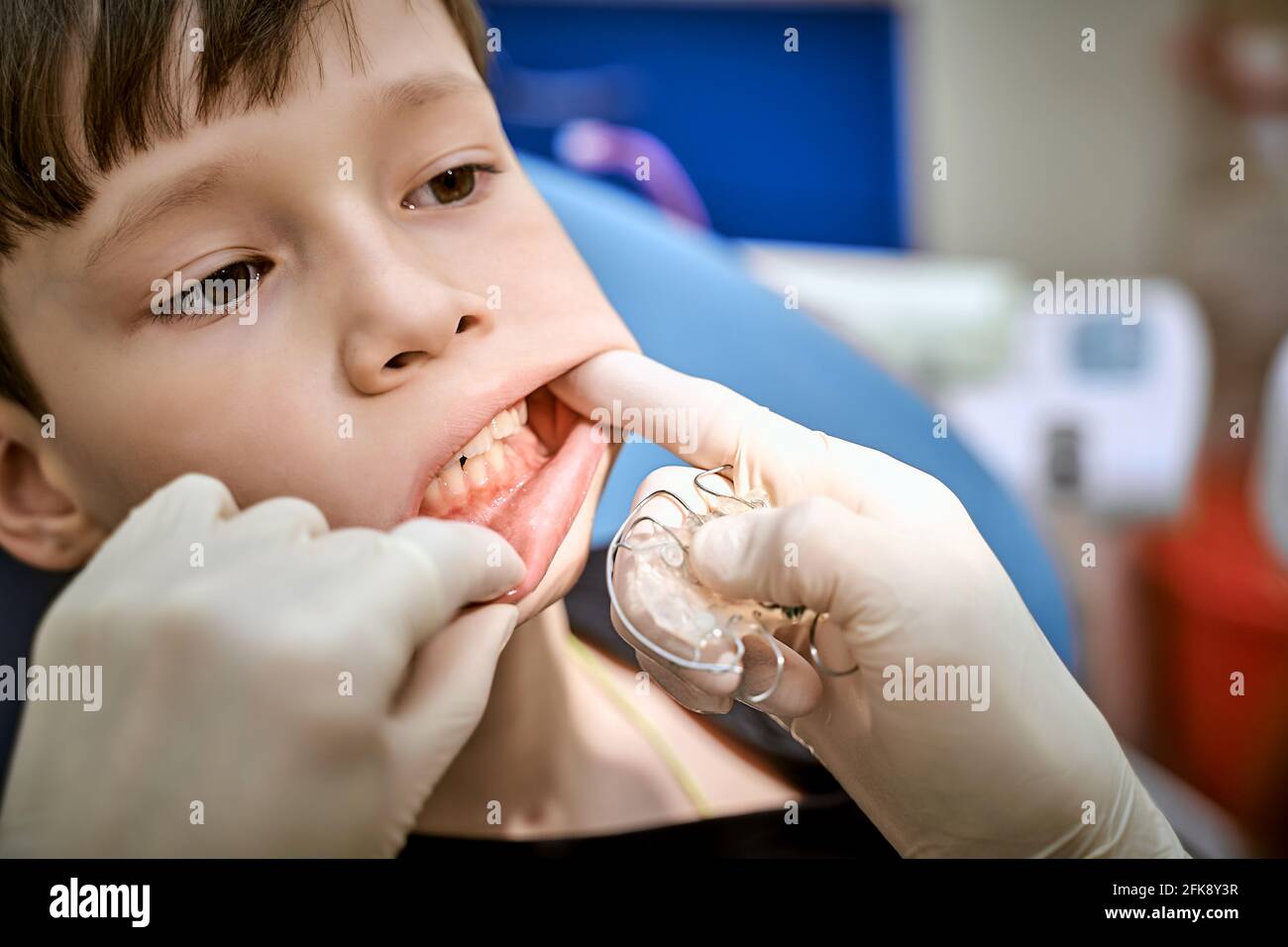 a child in a dentist's chair at a doctor's appointment Stock Photo