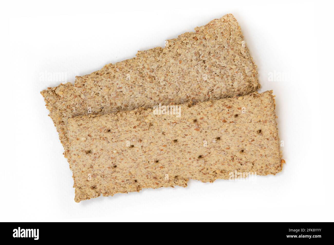 two light brown multigrain rye crispbreads isolated on white background