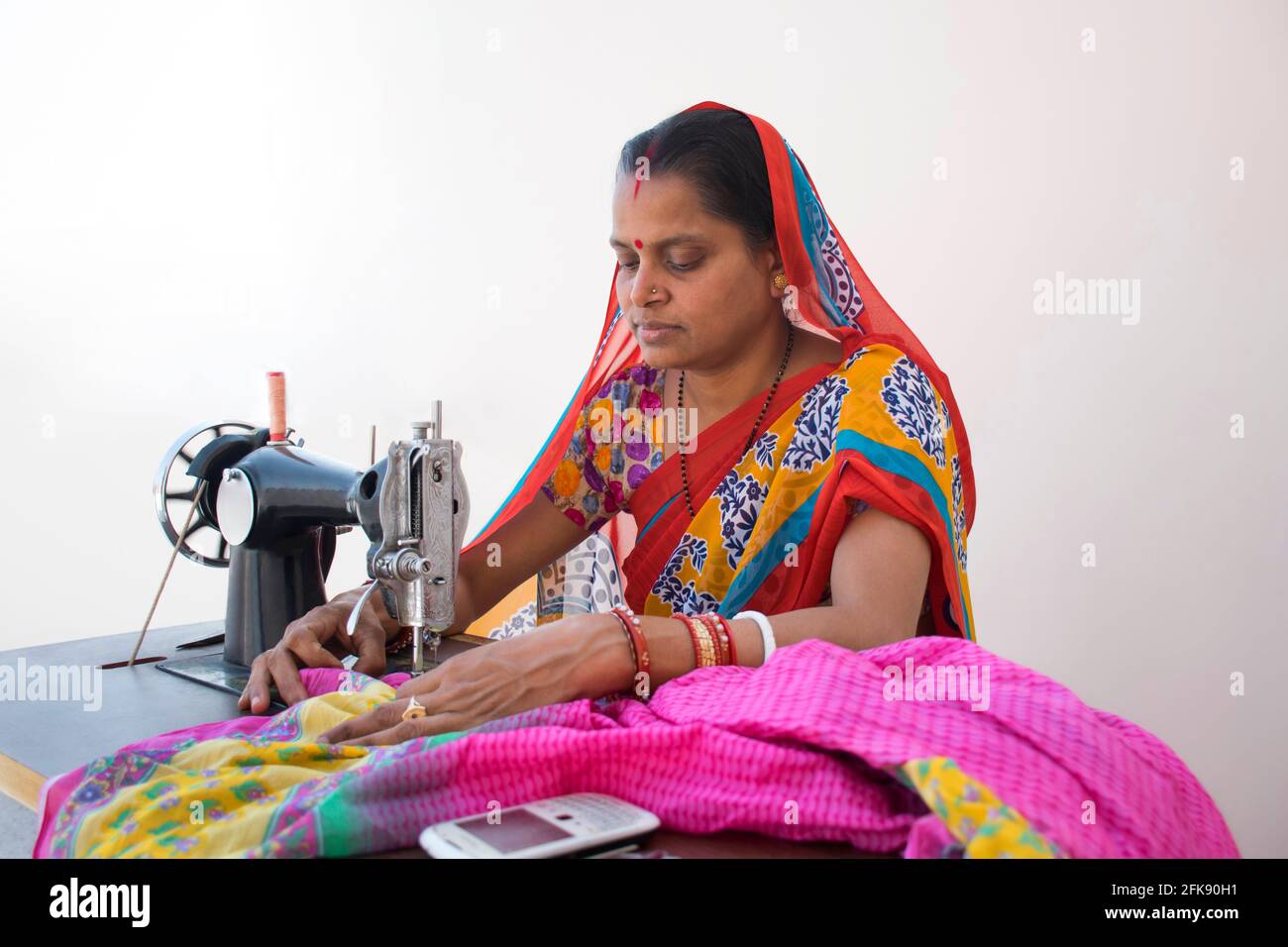 PORTRAIT OF A RURAL WOMAN STITCHING CLOTHES Stock Photo Alamy
