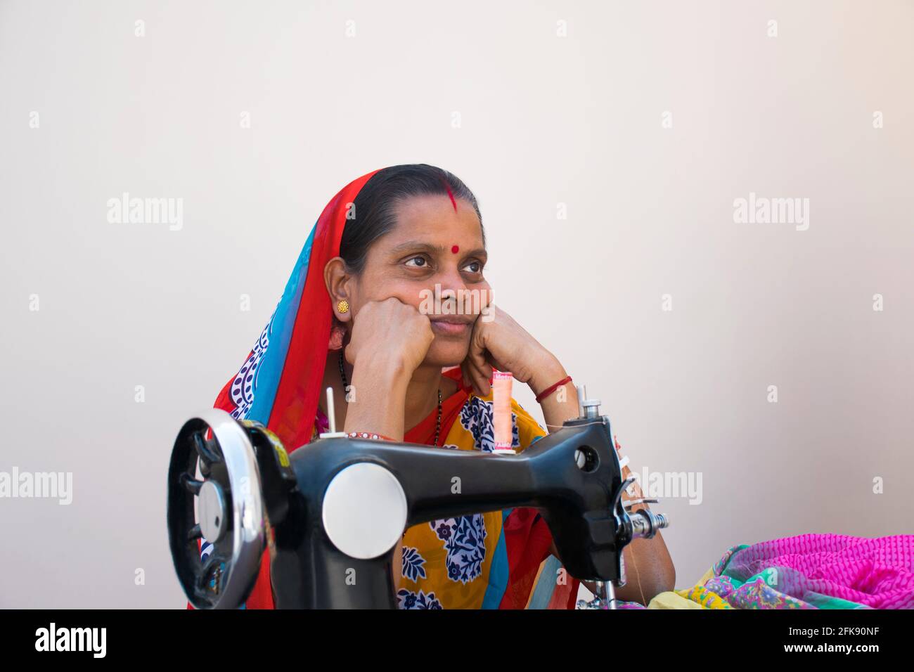 Indian With Machine Indian woman sewing machine hi-res stock photography and images - Alamy
