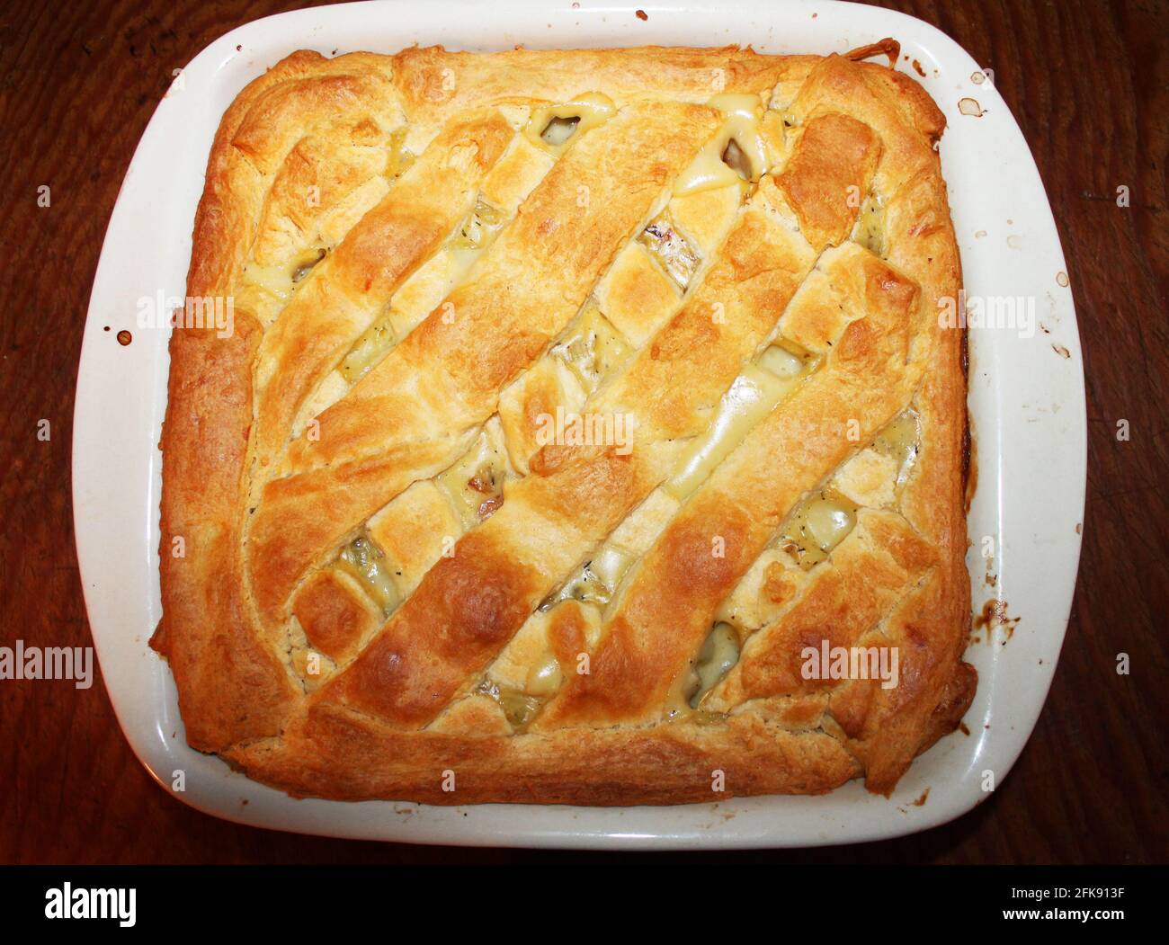 Close-up of a homemade chicken pot pie in a baking dish. Stock Photo