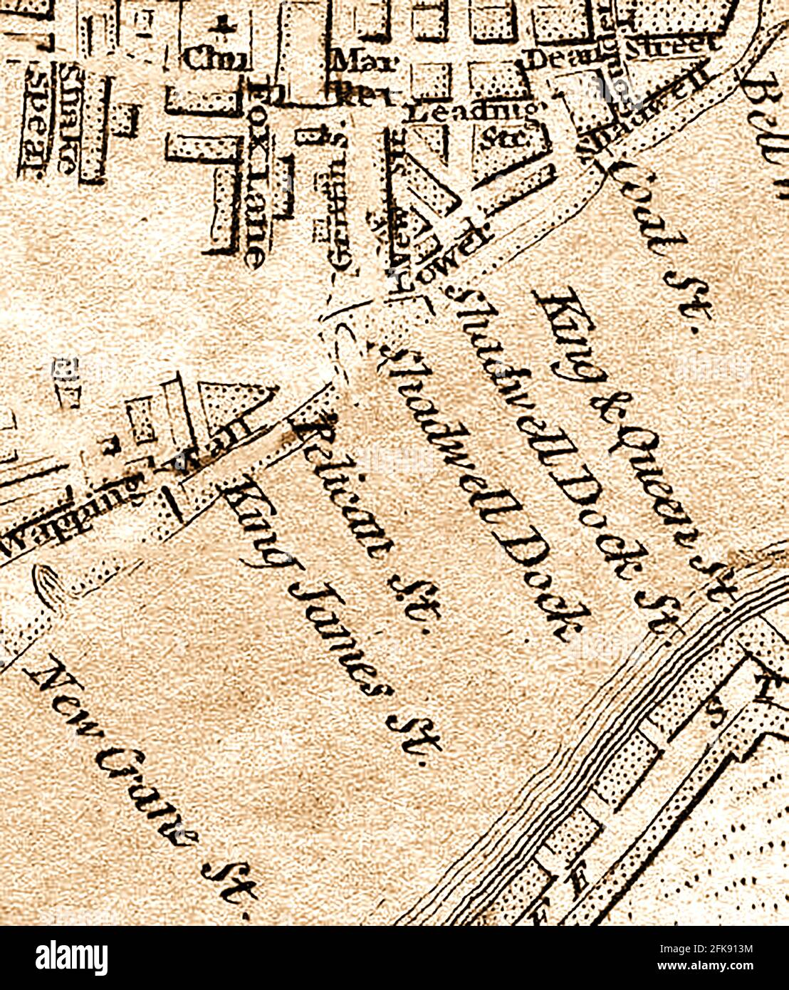 An extract from a very early 1800s map of the streets of Wapping Wall and lower Shadwell  overlooking the river Thames,London England including Shakespeare street or lane, Fox lane, Dean street, King James Street,Coal street, King and Queen Street, Shadwell dock, Pelican Street, New Crane Street, Grfiffin Street. The name Shadwell is believed to bederived from St Chad's Well. Stock Photo