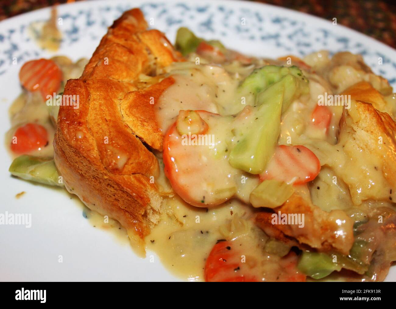 Close-up of a serving of chicken pot pie on a plate. Stock Photo