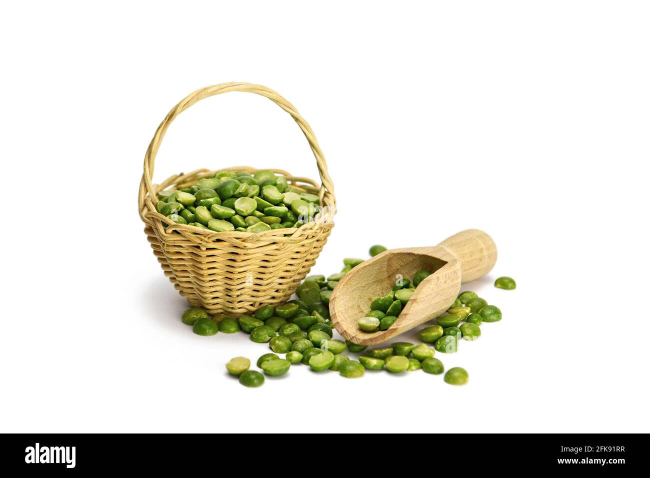 Split peas in woven basket isolated on white background Stock Photo