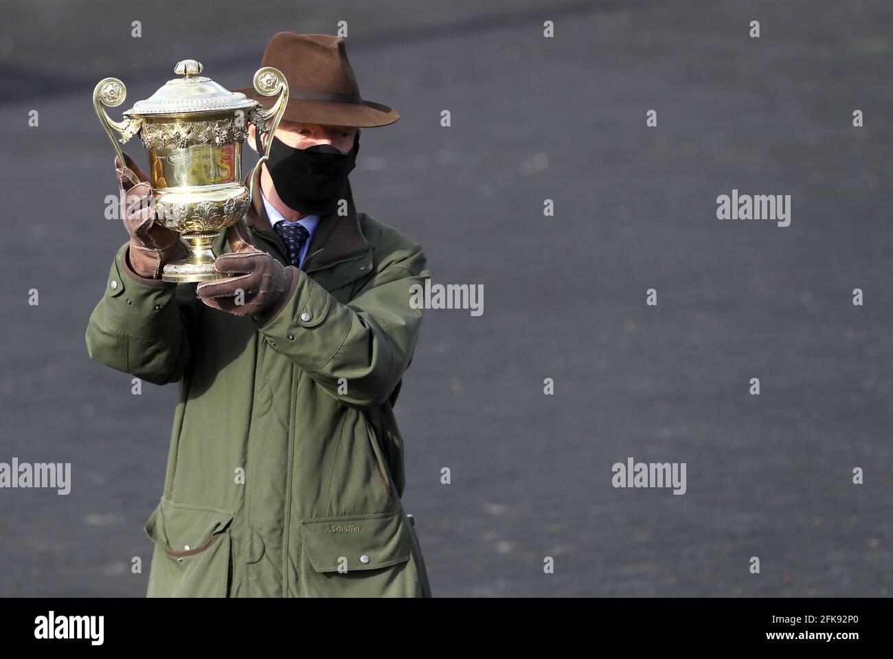 William Mullins, trainer of Klassical Dream, celebrates winning the Ladbrokes Champion Stayers Hurdle trophy during Day Three of the Punchestown Festival at Punchestown Racecourse in County Kildare, Ireland. Issue date: Thursday April 29, 2021. Stock Photo