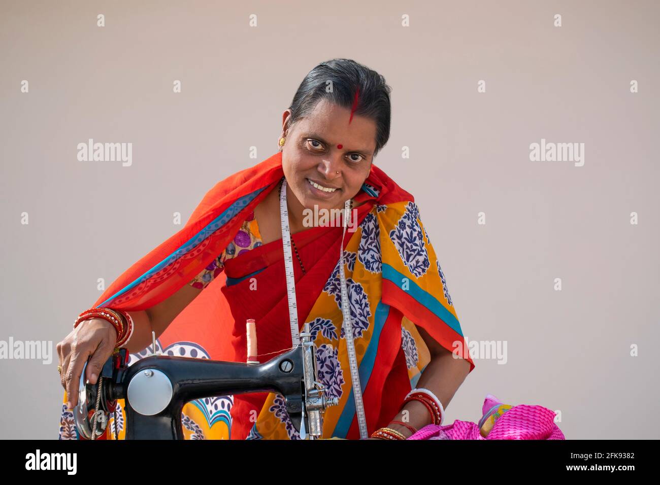 Indian woman stitching cloths by machine in rural India Stock Photo Alamy