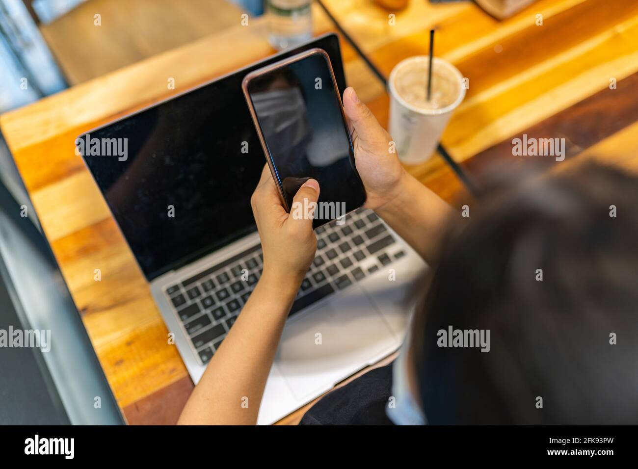 Woman texting at home rear view hi-res stock photography and images - Alamy