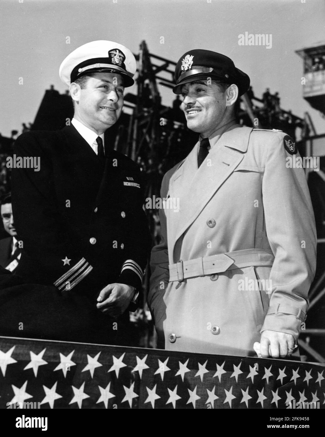 Lieutenant Commander ROBERT MONTGOMERY and Captain CLARK GABLE of the Army Air Forces at the christening ceremony for the Liberty Ship U.S.S. CAROLE LOMBARD on Saturday January 15th 1944 at the Terminal Island Docks between the Port of Los Angeles and Port of Long Beach, California Stock Photo