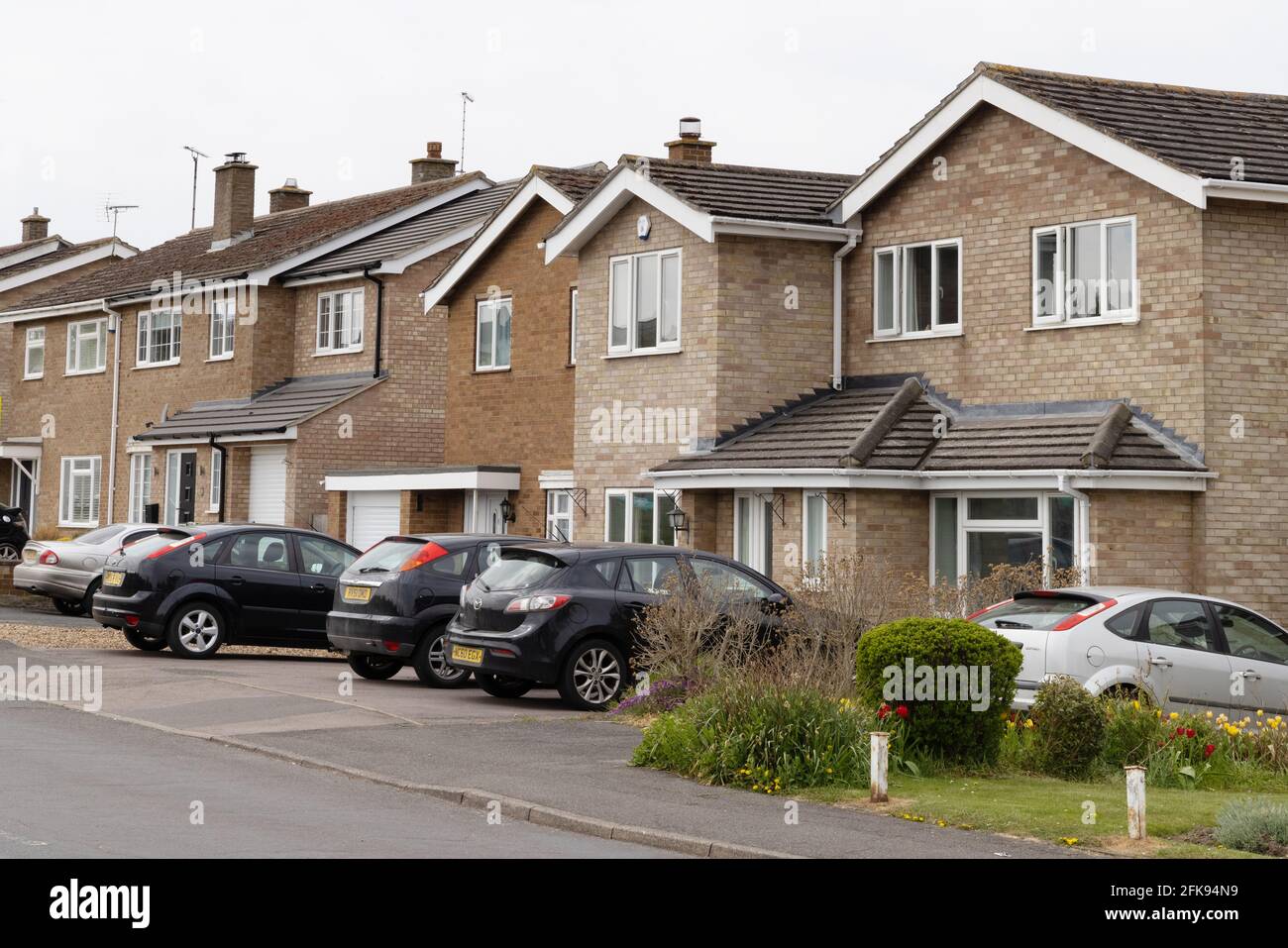 1960s housing estate UK; detached houses built on a housing development in the late 1960s; Suffolk UK Stock Photo