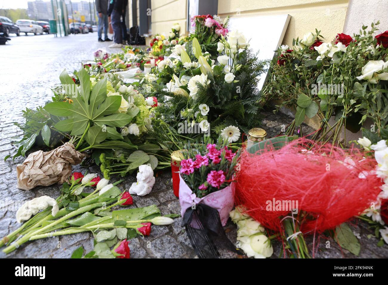 04/29/2021, Potsdam, Germany,. Flowers and signs in front of the house. Four dead were discovered in the 'Oberlin-Lebenswelten' care facility in Potsdam for people with disabilities. An urgently suspect 51-year-old woman was arrested. The victims have stab wounds. Stock Photo