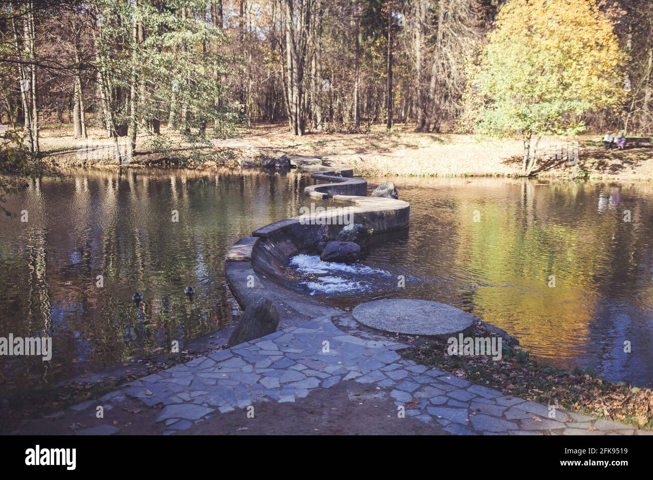 Footbridge across the river made of step stones Stock Photo