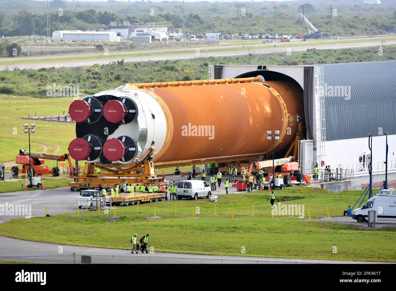 Kennedy Space Center, United States. 29th Apr, 2021. NASA's first SLS rocket is towed to the Vehicle Assembly Building from the Pegasus Barge at the Kennedy Space Center, Florida on Thursday, April 29, 2021. SLS is scheduled for its maiden mission by the end of 2021. The rocket is NASA's heavy-lift vehicle to be used on its Artemis Program, boosting American men and women back to the moon by 2024. Photo by Joe Marino/UPI Credit: UPI/Alamy Live News Stock Photo