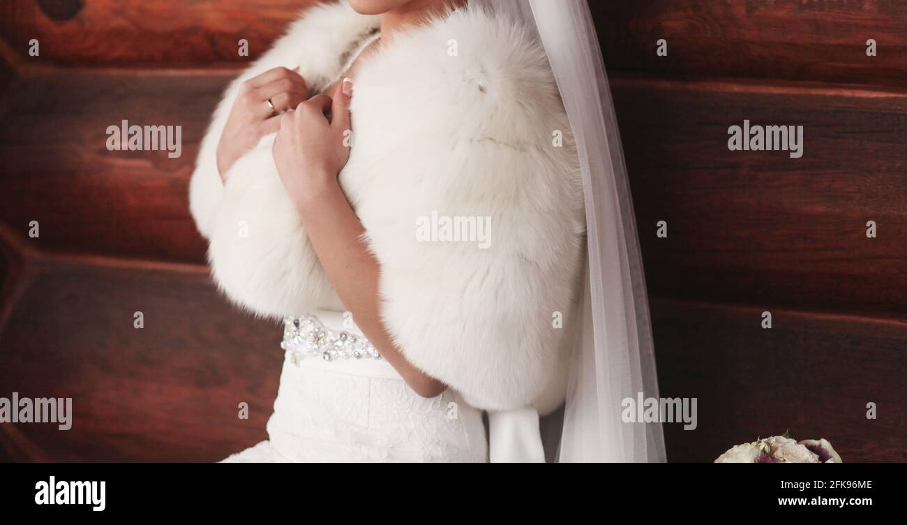 rich bride in a white fur coat. wedding concept Stock Photo Alamy