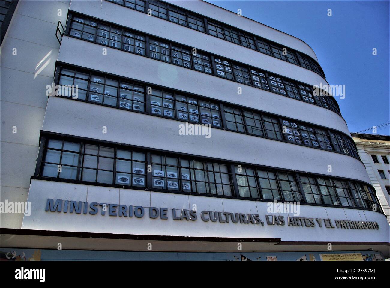 Protest posters in the windows of Ministry of Culture,highlighting protesters eye injuries in street demonstrations,Plaza Sotomayor,Valparaiso,Chile Stock Photo