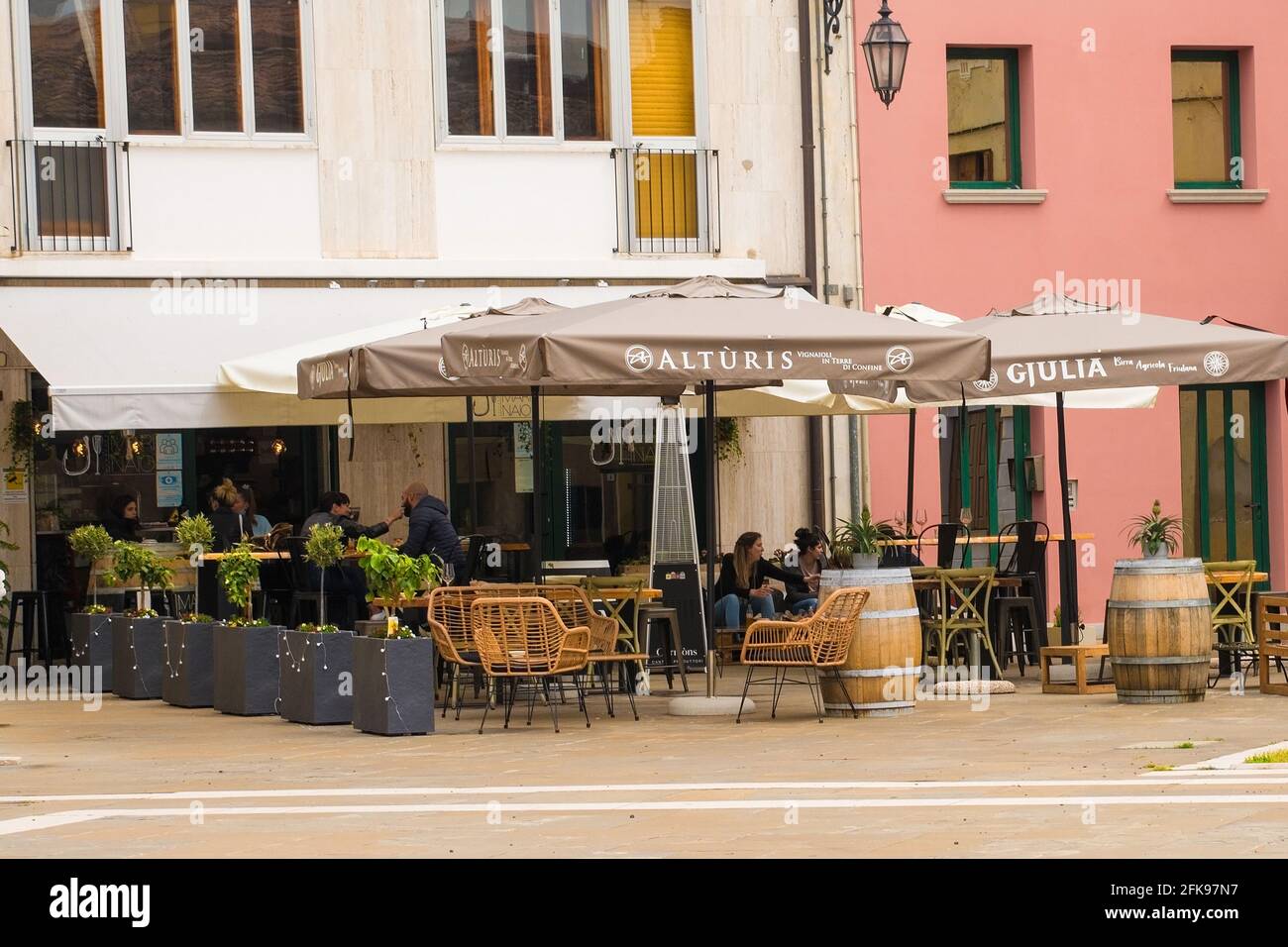 Marano Lagunare,Italy-April 29th 2021.A bar customers as bars are allowed to re-open, outside only, a few days after the 3rd national lockdown ends Stock Photo