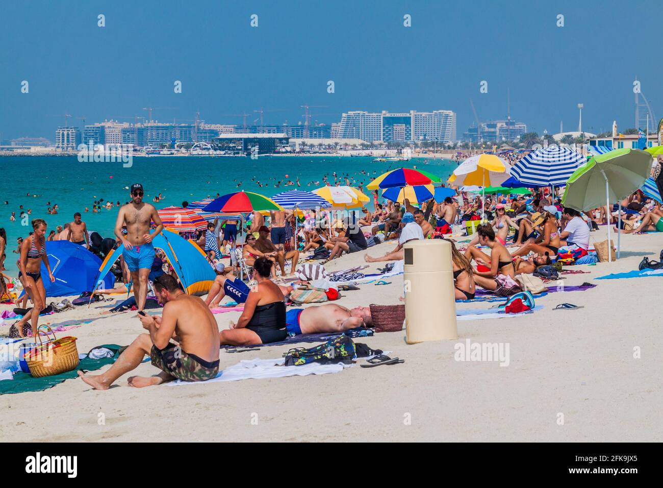 DUBAI, UAE - OCTOBER 21, 2016: People at Marina Beach in Dubai, United Arab Emirates Stock Photo