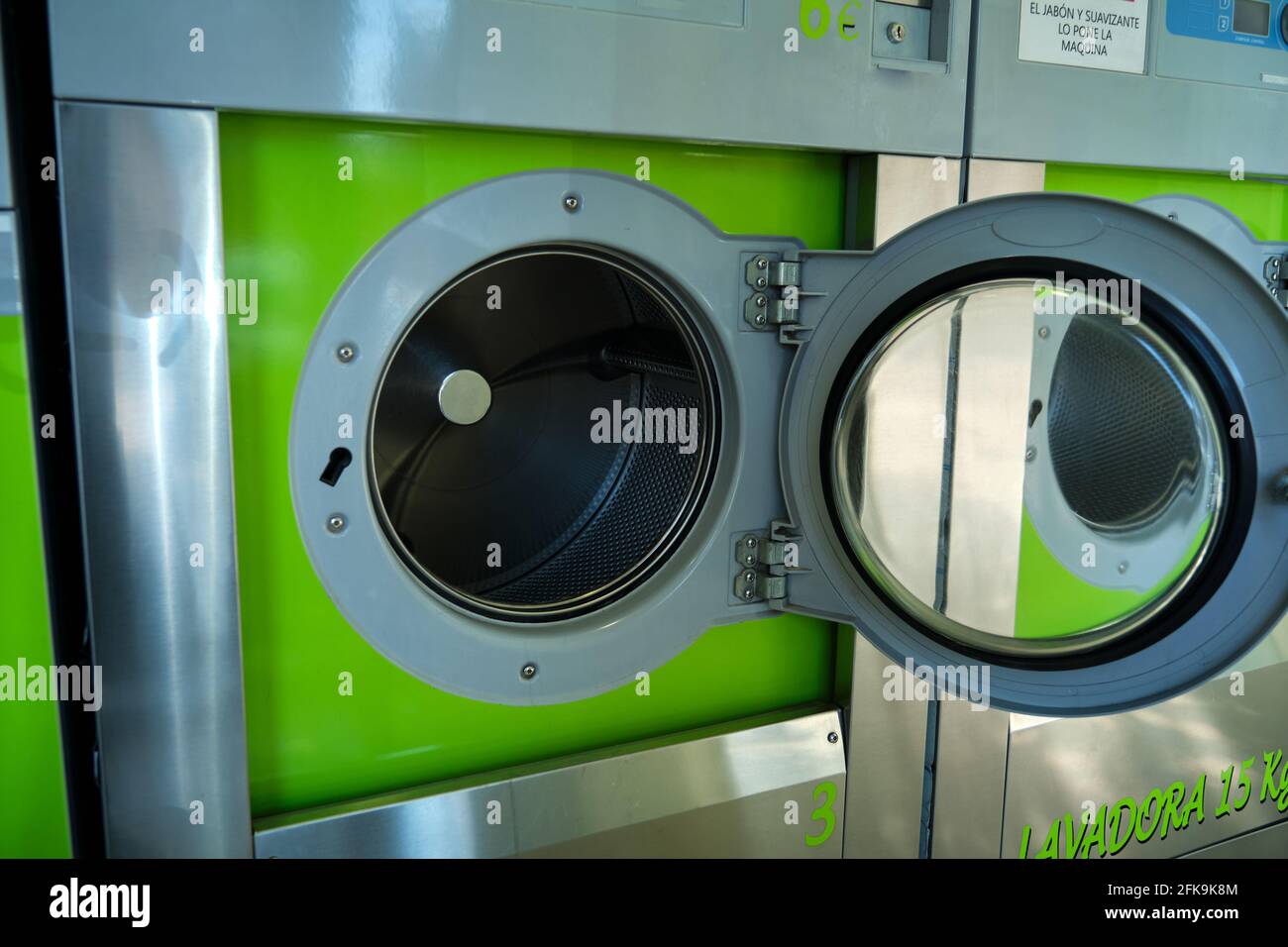 public washing machine industrial with open doors Stock Photo Alamy