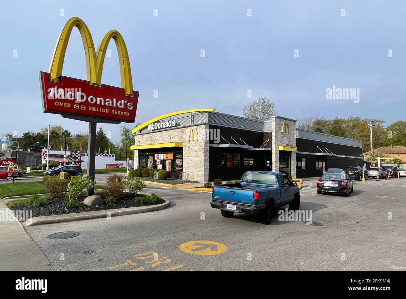 Cars wait in a drive-thru line at a McDonald's restaurant, Wednesday ...