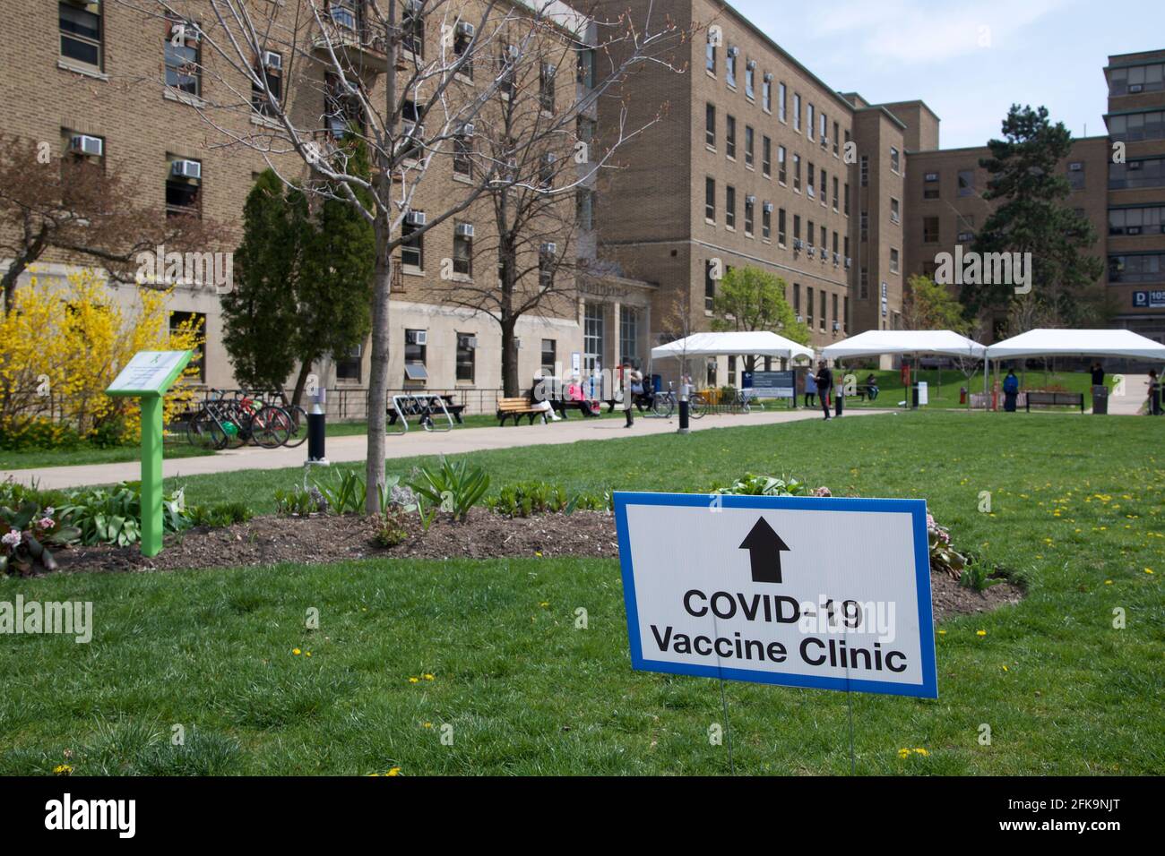 Toronto, Ontario, Canada - 27th April 2021: A direction sign was put up to show the entrance of the COVID-19 Vaccination Clinic ( Sunnybrook Hospital ) in Toronto, Canada. Stock Photo