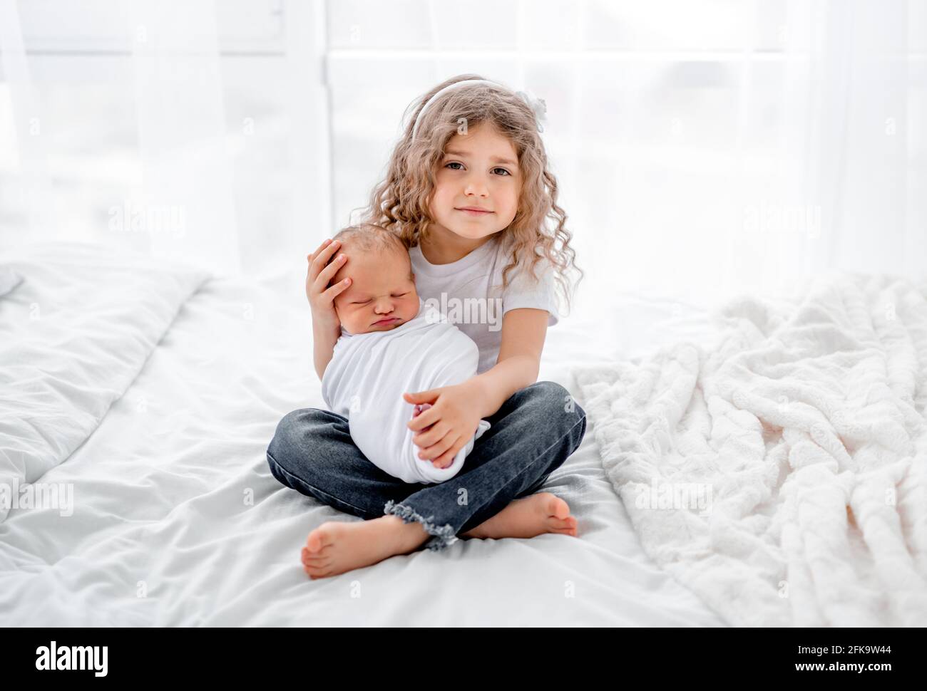 Newborn baby and sister Stock Photo Alamy