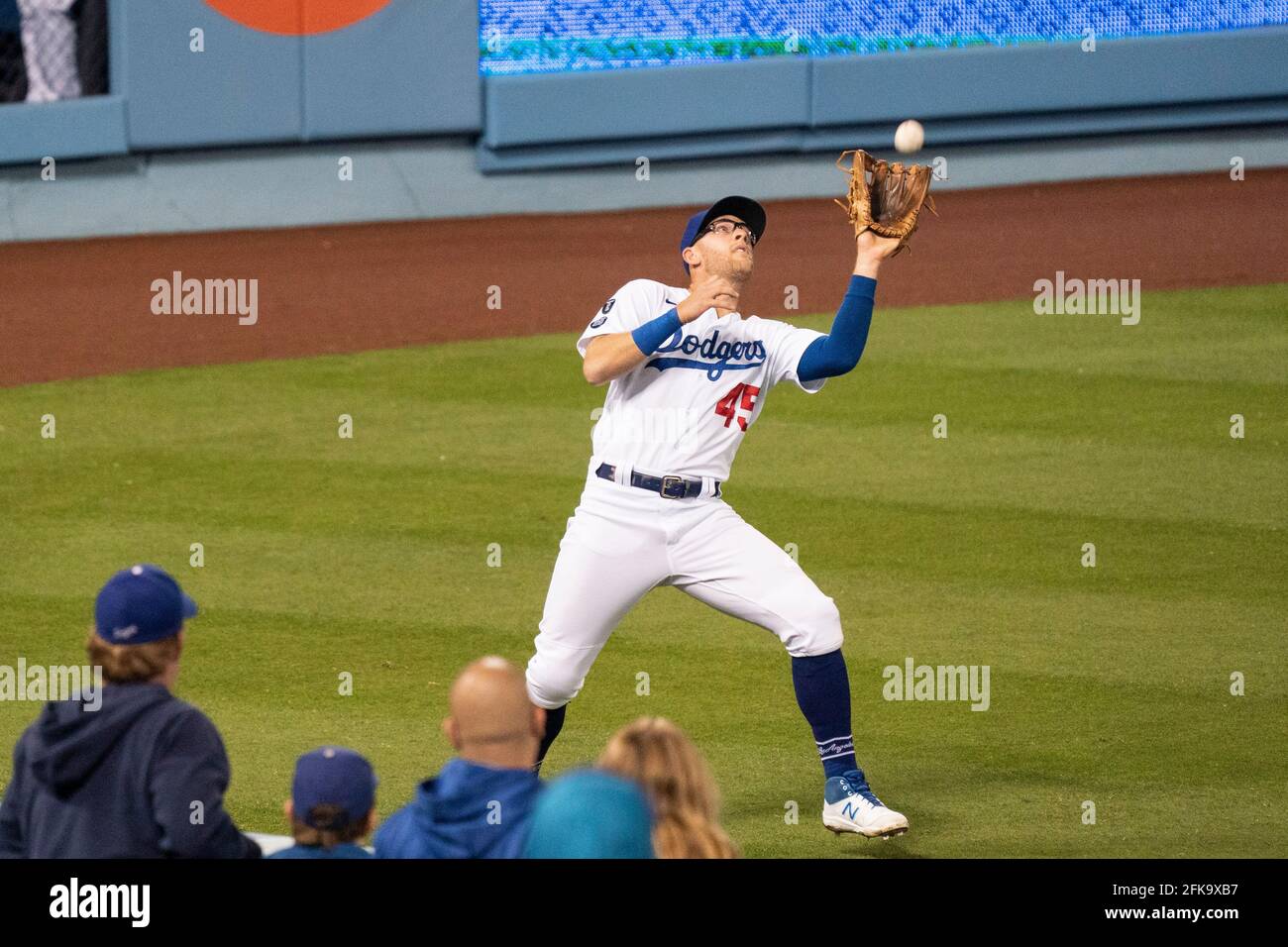 Los Angeles Dodgers first baseman Matt Beaty (45) catches a fly ball during a MLB game against the Cincinnati Reds, Tuesday, April 27, 2021, in Los An Stock Photo