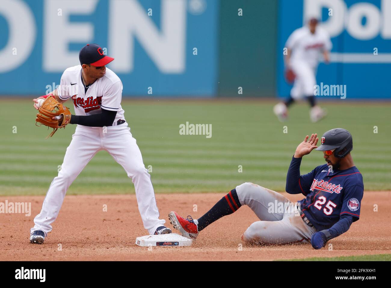 CLEVELAND, OH - APRIL 28: Cesar Hernandez (7) of the Cleveland Indians turns a double play ahead of the sliding Byron Buxton (25) of the Minnesota Twi Stock Photo