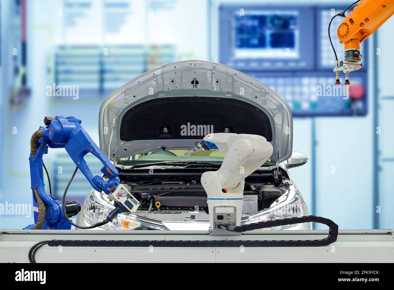 Industrial robotic teamwork working with automobile on blurred smart  factory blue tone color background, robot work instead of human, industry  4.0 Stock Photo - Alamy