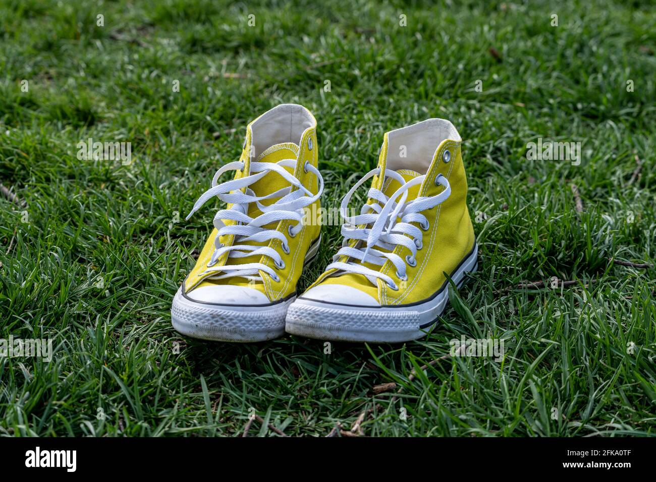 Converse shoes grass hi-res stock photography and images - Alamy
