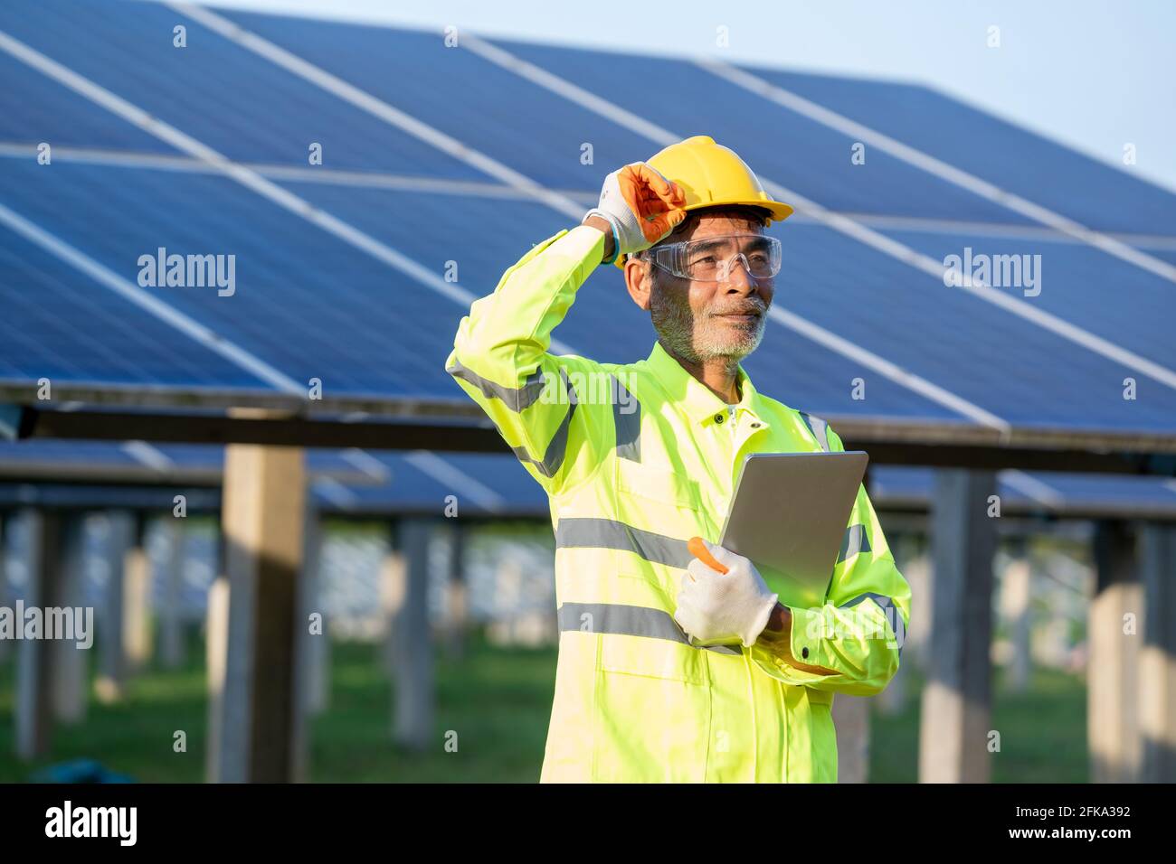 Supervisor Engineers men wearing safety vest and safety helmet Stock Photo