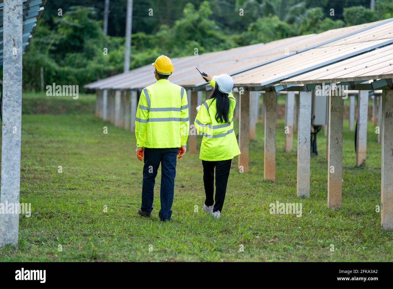 Technician walked along with an engineer to inspect Stock Photo