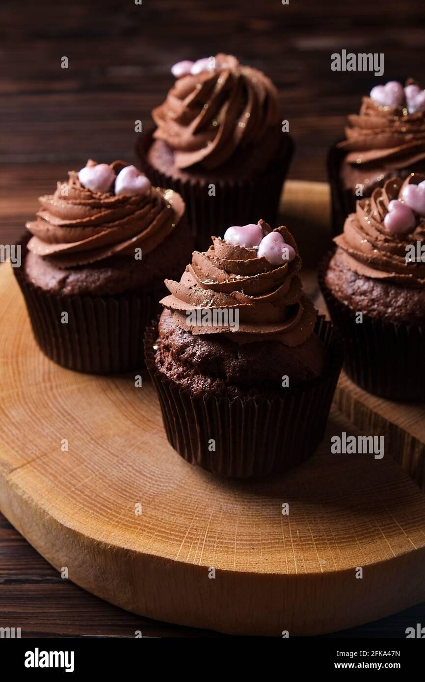 Delicious dark chocolate buttercup cupcakes, sugar heart topping ...