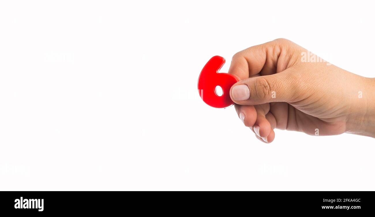 Number 6 in plastic, hand holds Text space Stock Photo Alamy