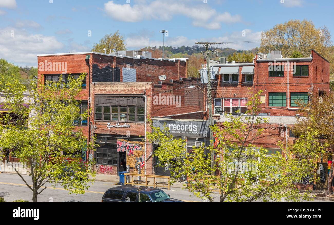 ASHEVILLE, NC, USA-25 APRIL 2021: Older commercial buildings on Broadway near Woodfin St. Blue sky, spring day. Stock Photo