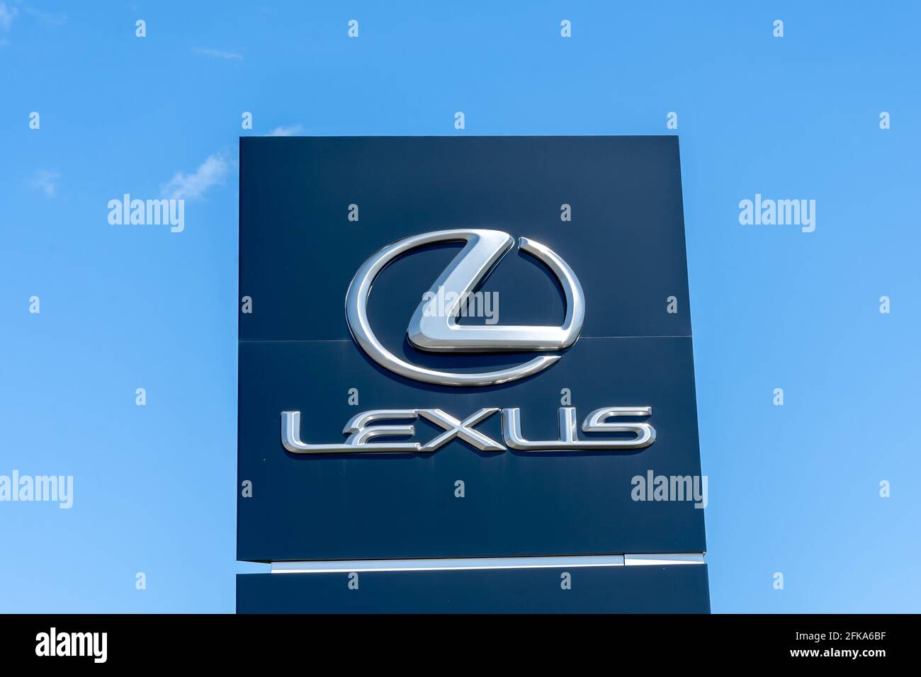 Barrie, Ontario, Canada - August 4, 2019: Close up of Lexus pole sign with blue sky in background. Stock Photo