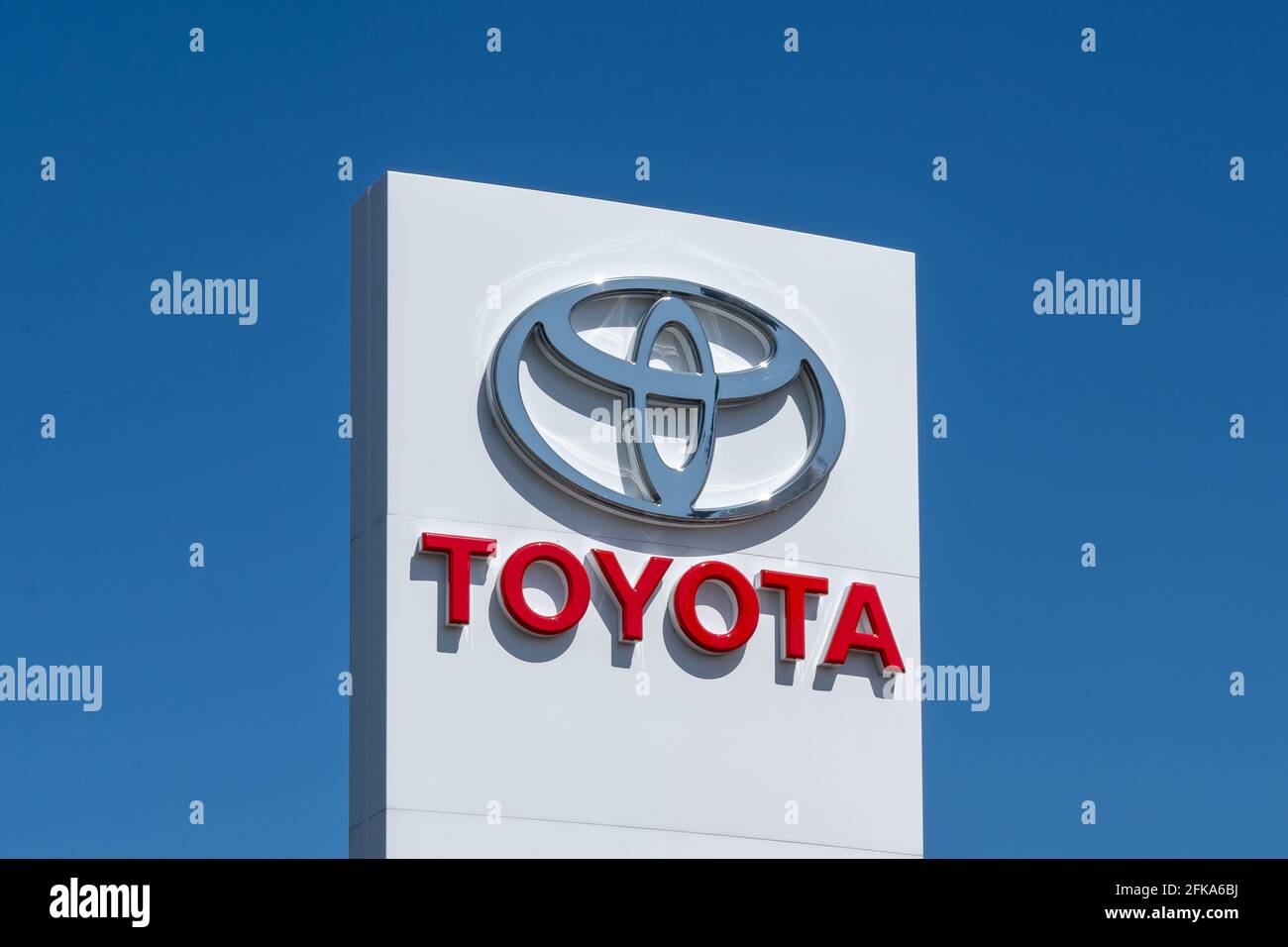 Barrie, Ontario, Canada - August 4, 2019: Close up of Toyota sign with blue sky in background. Stock Photo