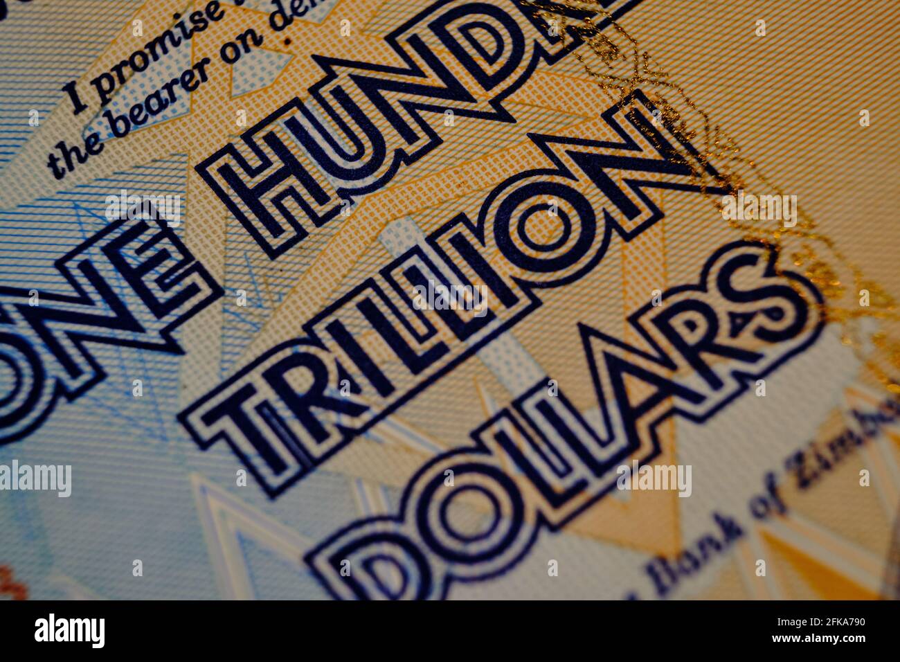 Close up of text of a Zimbabwe One Hundred Trillion Dollars bill Stock Photo