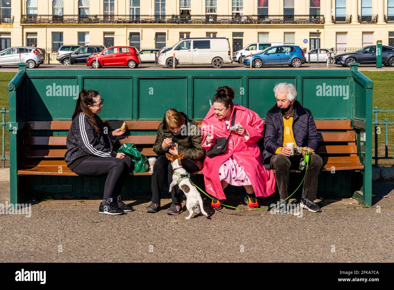 A Group Of Local People Enjoying The Sunshine On Hove Seafront, Brighton, East Sussex, UK. Stock Photo