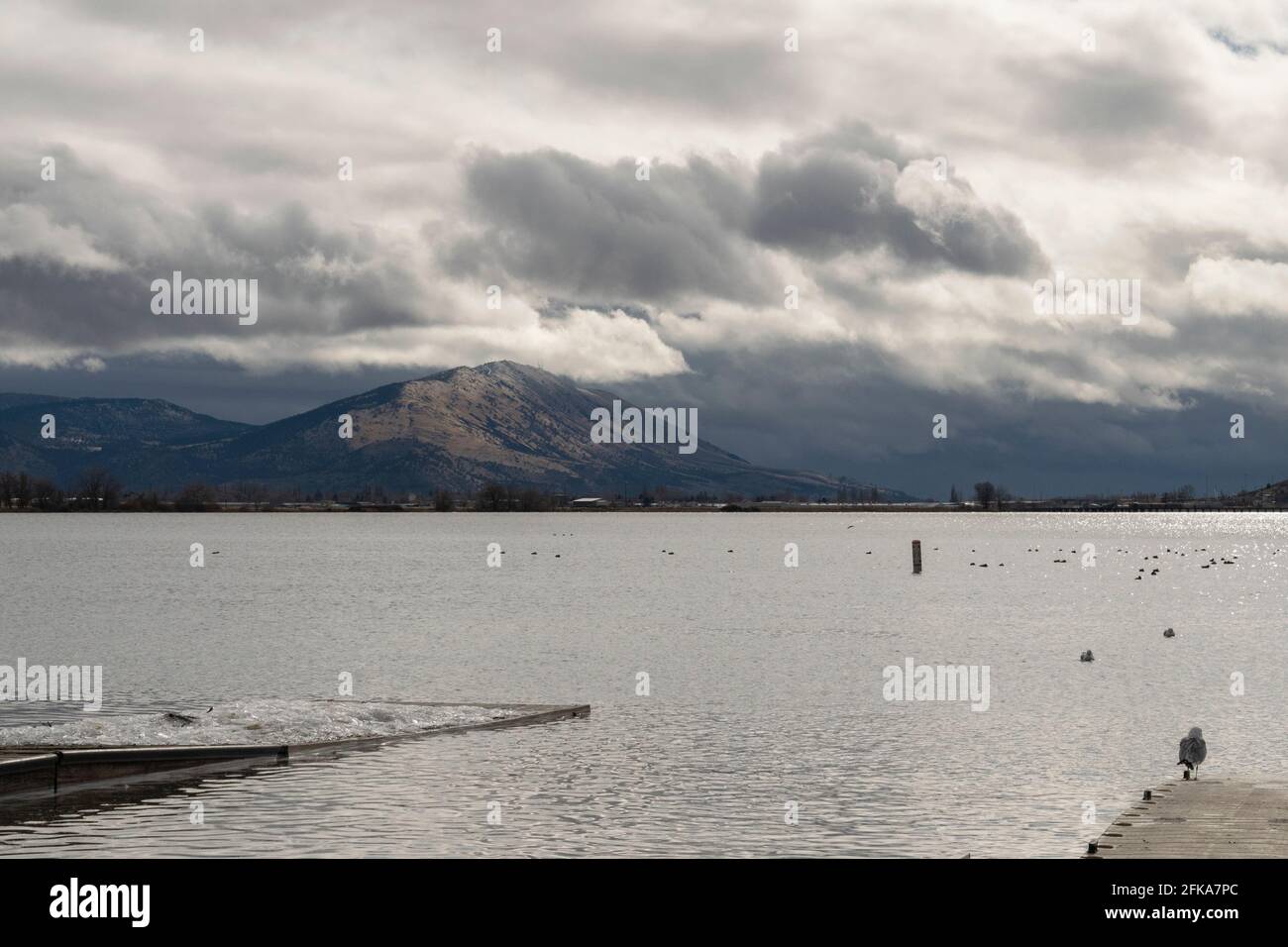 Clouds gather over Stukel Mountain next to Lake Ewauna in Klamath Falls, Oregon. Stock Photo