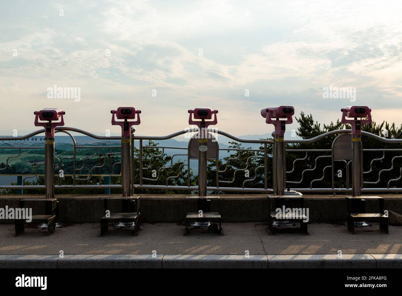 Coin operated binoculars for tourists overlooking the scenery near Gyeongju National Park, South Korea Stock Photo