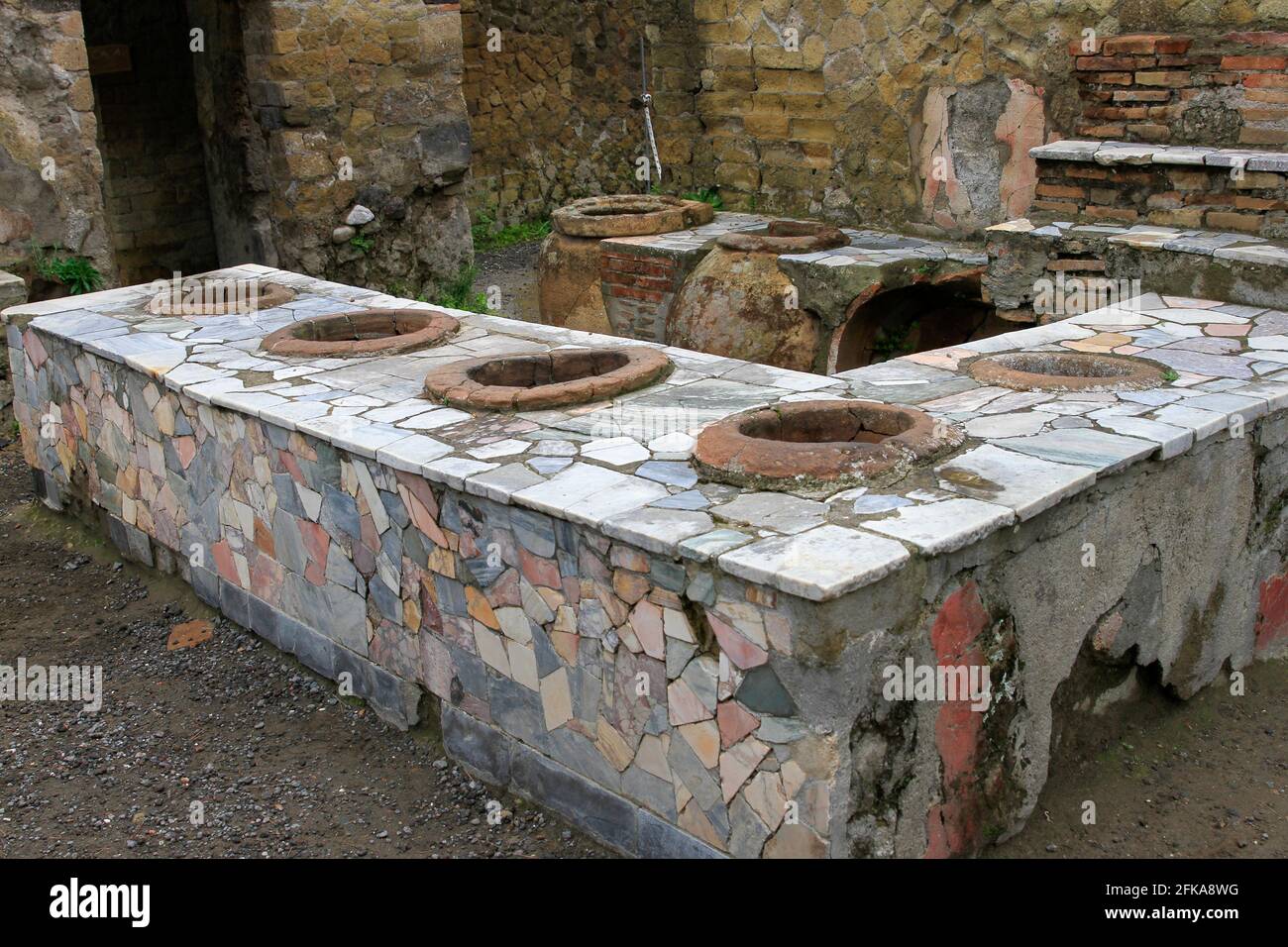 Ruins of stone restaurant food counter at Pompeii, Italy Stock Photo