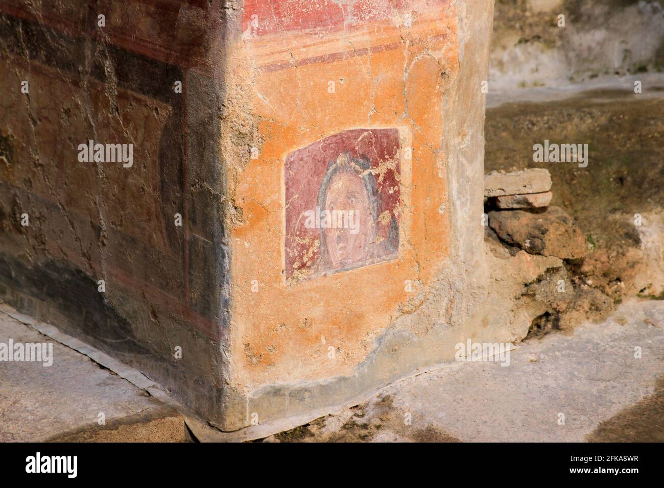 Ancient fresco of woman's surprised face, Pompeii, Italy Stock Photo