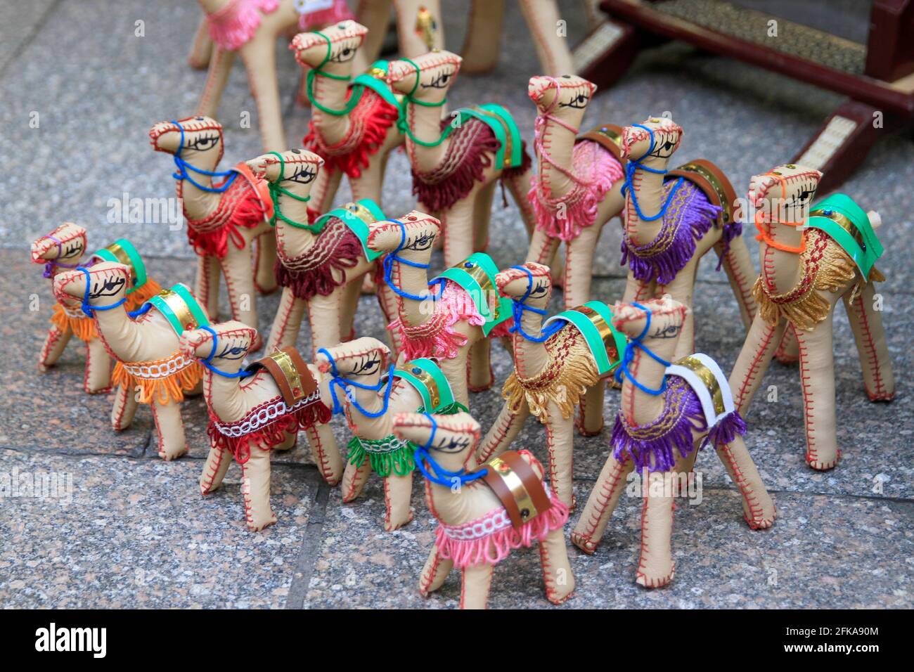 Rows of colorful souvenir stuffed camels at the marketplace in Cairo, Egypt Stock Photo