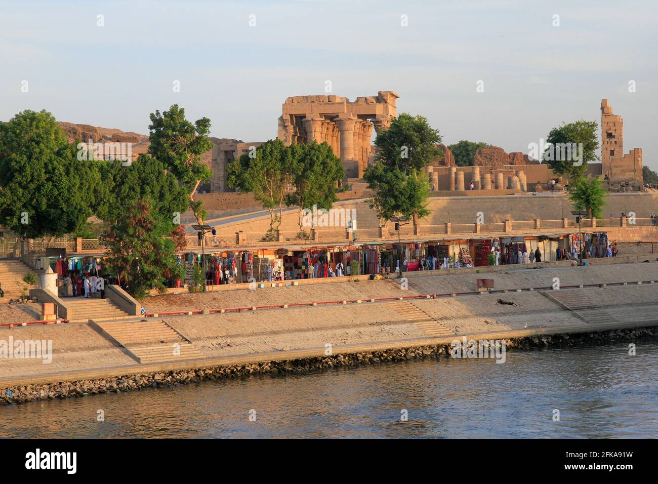 Temple of Kom Ombo from Nile River with riverside market place, Kom Ombo, Aswan, Egypt Stock Photo