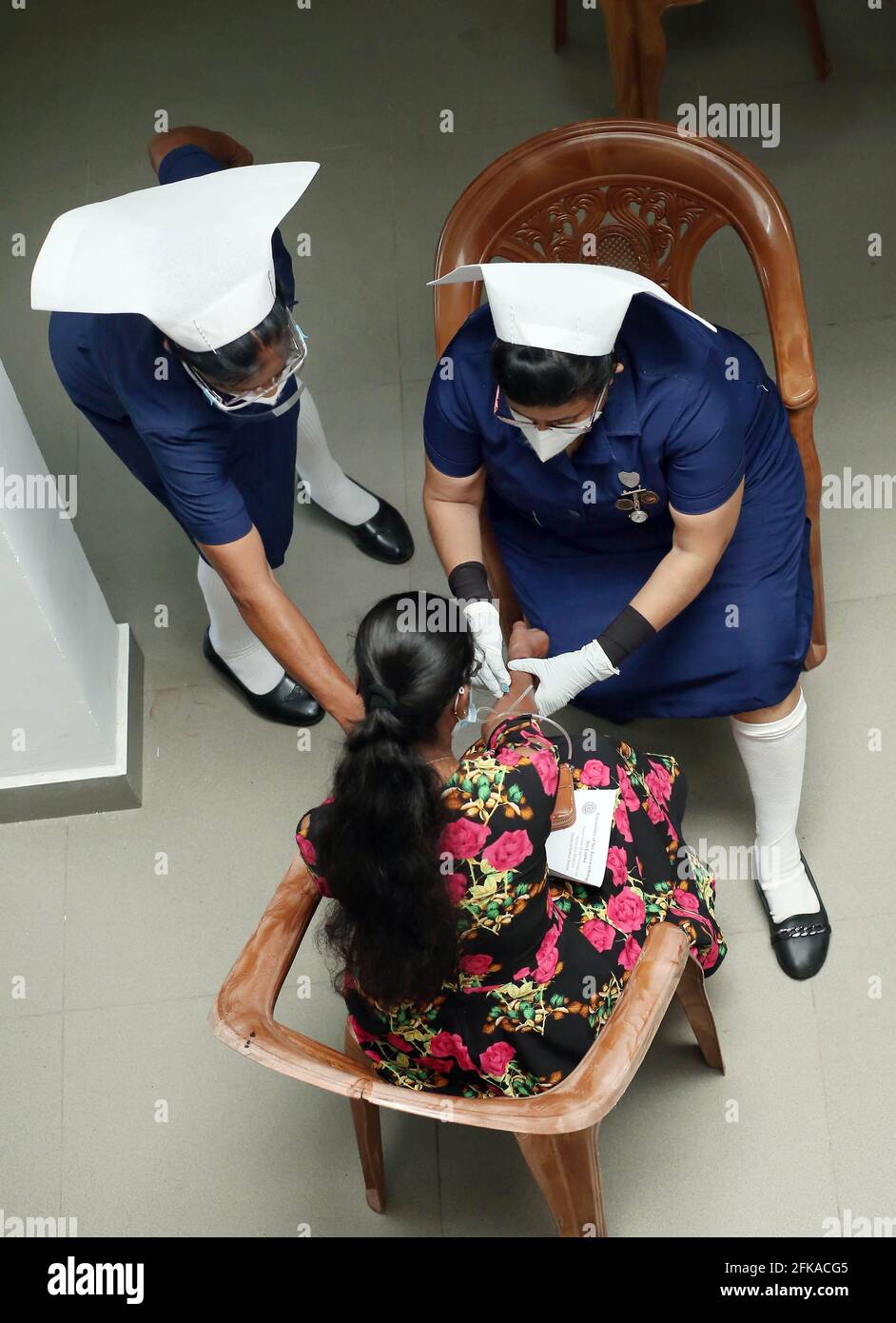 Colombo, Sri Lanka. 29th Apr, 2021. A woman gets inoculated with COVID-19 vaccine in Colombo, Sri Lanka, April 29, 2021. Credit: Ajith Perera/Xinhua/Alamy Live News Stock Photo