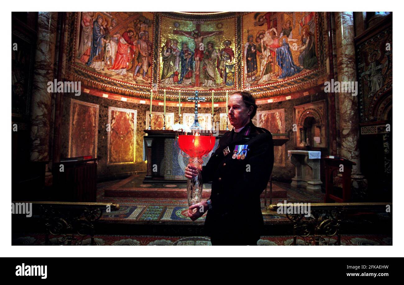 The Reverend Leslie H Bryan C.F. Senior CHaplain The Household Division with the Beacon Millennium Flame. The flame was Brought from Sunderland  and kept in the Guards Chapel at Wellington Barracks untill the afternoon of the 31st. December. Stock Photo