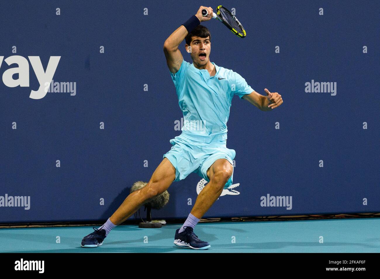 Miami Gardens, Florida, USA. 24th Mar, 2021. Carlos Alcaraz of Spain hits a forehand during his loss to Emil Ruusuvuori of Finland in the first round at the Miami Open on March 24, 2021 on the grounds of Hard Rock Stadium in Miami Gardens, Florida. Mike Lawrence/CSM/Alamy Live News Stock Photo