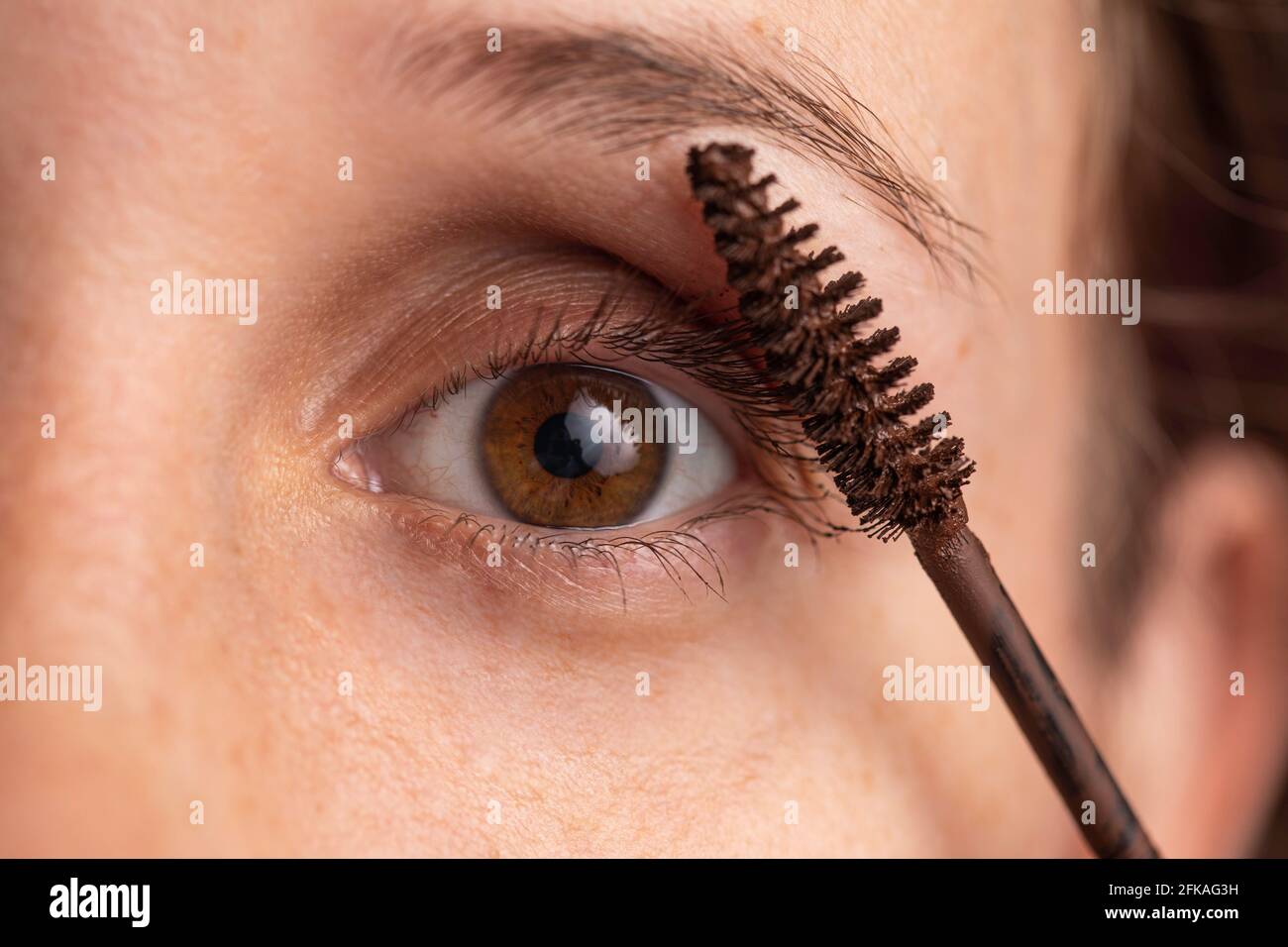 woman face applying mascara Stock Photo