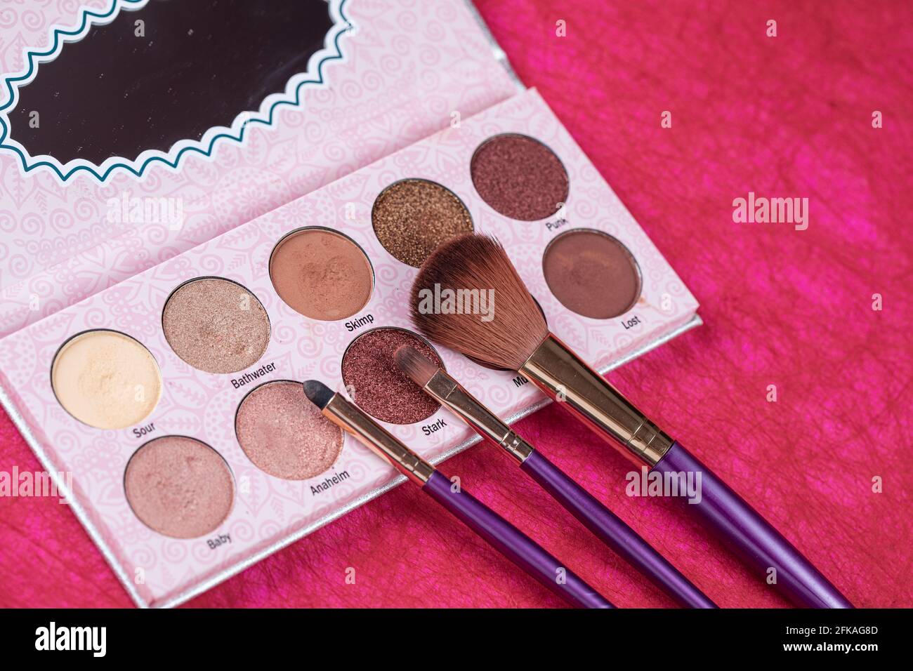palette of eyeshadow and make up brushes Stock Photo